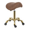 saddle stool with adjustable height and gold base and gaslift