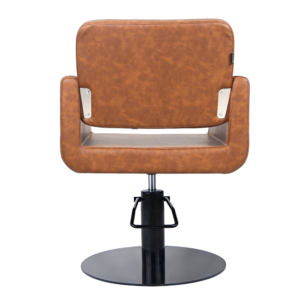 tan vinyl styling chair with black round base