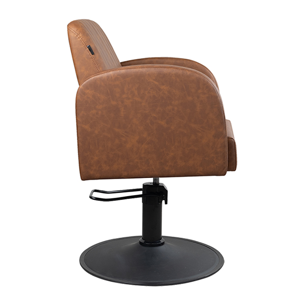 almira salon chair with hydraulic lift and upholstered in tan vinyl